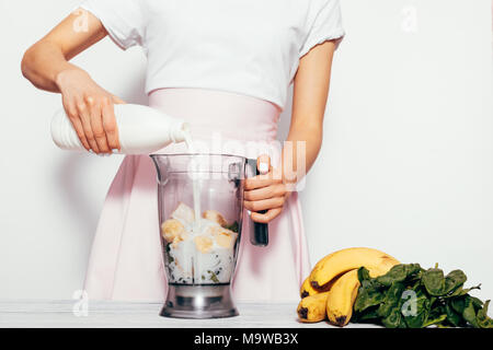 Premium Photo  Woman with hand blender making sweet banana