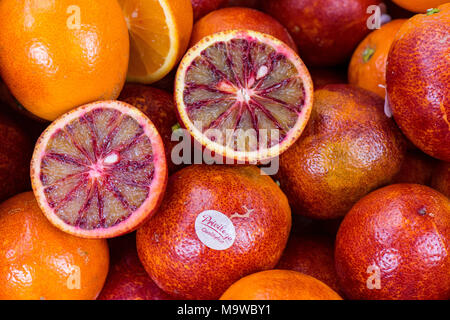 a basket or display of blood oranges sweet and juicy on borough market in central london. fruits and vegetables market stalls fresh fruits for sale. Stock Photo