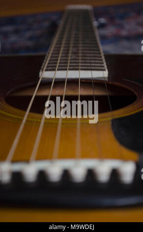 Acoustic Guitar View from Base of Strings Stock Photo