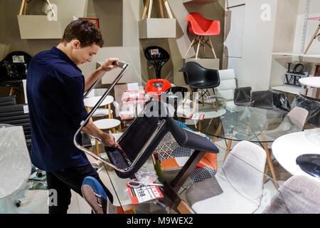 Buenos Aires Argentina,Recoleta,Buenos Aires Design mall,home furnishings,decor,chair,adult adults man men male,stock clerk,assembling,visitors travel Stock Photo