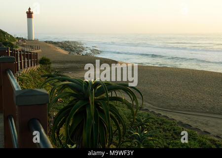 Beautiful dawn light falling on the beachfront of Umhlanga Rocks near the iconic lighthouse, eastern seaboard of South Africa Stock Photo