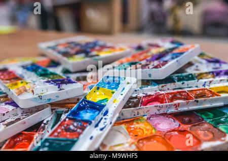 Details of dirty watercolors palette. Painting Studio tools Stock Photo