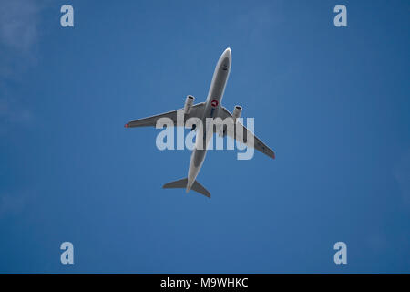 Istanbul, Turkey - March 15, 2018 : A Turkish Airlines passenger airplane at the sky from bottom view. Stock Photo