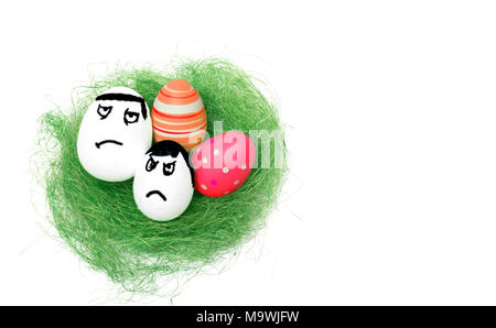 Anger eggs hidden in the grass. Easter funny eggs, Commando eggs, revenge Stock Photo