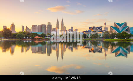 Sunrise Panoramic view of Kuala Lumpur city waterfront skyline with reflections and beautiful morning sky, Titiwangsa Park, Malaysia. Big size Stock Photo