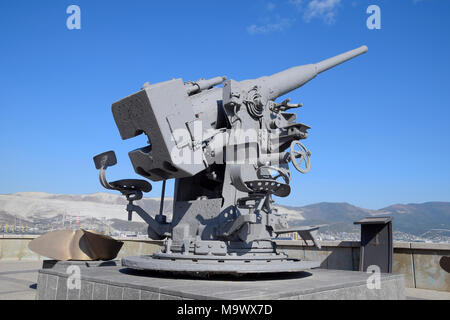 Artillery battle cannon, raised from the bottom of the Black Sea. Weapons of defense in the Second World War. The restored exhibit. Stock Photo