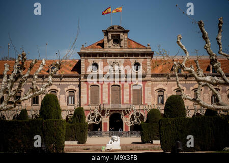 Barcelona, Catalonia, Spain. 28th Mar, 2018. The Catalan and the Spanish flag atop of the main facade of the Catalonian Parliament building. The independentist parties of the Catalan parliament vindicate the right of Carles Puigdemont to be invested as Catalonia president. Carles Puigdemont is being held by the German authorities after been arrested on an international warrant. Credit: Jordi Boixareu/ZUMA Wire/Alamy Live News Stock Photo