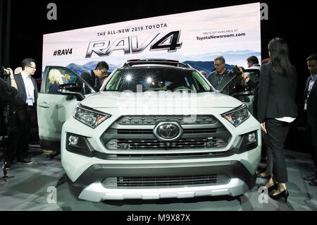 New York, USA. 28th Mar, 2018. People look at a 2019 Toyota RAV4 during a media preview of the 2018 New York International Auto Show in New York, the United States, on March 28, 2018. The debut of the all-new 2019 Toyota RAV4 was made here on Wednesday. Credit: Wang Ying/Xinhua/Alamy Live News Stock Photo