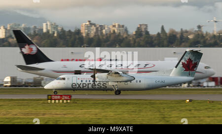 Richmond, British Columbia, Canada. 27th Mar, 2018. An Air Canada Express Bombardier Dash 8 (C-FJXZ) twin-engine turboprop regional airliner, operated by Jazz, speeds down the runway as it takes off from Vancouver International Airport. Jazz Aviation LP (Jazz) is a subsidiary of Chorus Aviation Inc. and is headquartered in Dartmouth, Nova Scotia, Canada. Credit: Bayne Stanley/ZUMA Wire/Alamy Live News Stock Photo