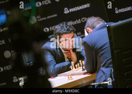 22 March 2018, Germany, Berlin: Italian-American chess champion Fabiano  Caruana competes against Shakhriyar Mamedyarov (not shown), a chess  champion from Azerbaijan, at this year's FIDE World Chess Candidates  Tournament at the Kuehlhaus