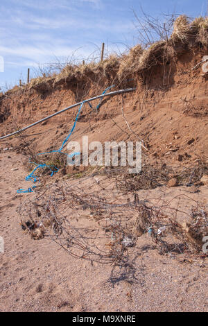 Further evidence of coastal erosion on the beach at Carsethorn, Dumfries and Galloway region, Scotland.  Debris in the foreground. Stock Photo