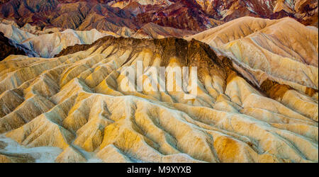 Colorful geologic formations of Zabriskie Point at sunrise in Death Valley National Park, California Stock Photo