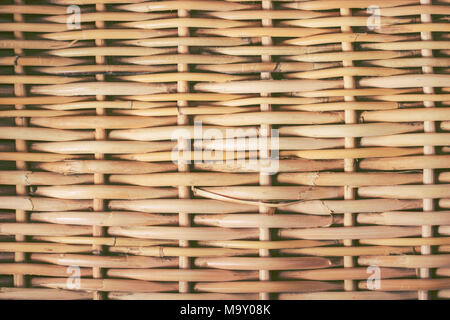 woven rattan with natural patterns Natural ecological background. Handmade traditional basket. Stock Photo