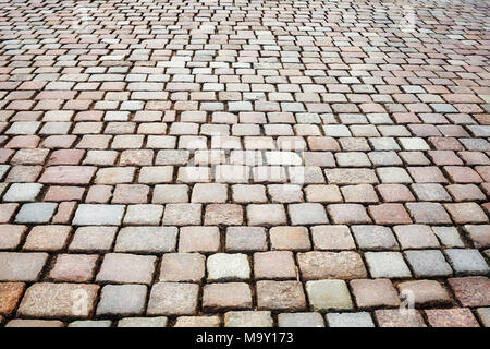 Old cobblestone street pavement, urban background. Stock Photo