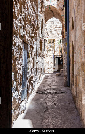 Narrow stone street in ancient Old Town of Jerusalem, Israel Stock Photo