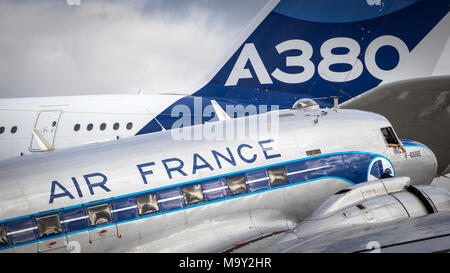 PARIS, FRANCE - JUN 23, 2017: Vintage Dakota DC-3 from Air France in front of the large modern Airbus A380 airliner at the Paris Air Show.2017 Stock Photo