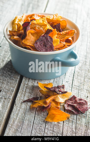 Mixed fried vegetable chips in pot. Stock Photo