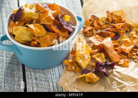 Mixed fried vegetable chips in pot. Stock Photo