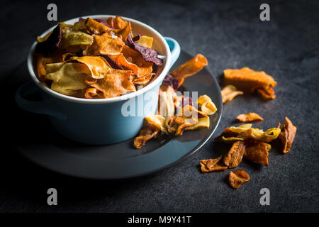 Mixed fried vegetable chips in pot. Stock Photo