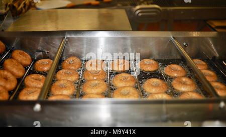 Hot, fresh fried cider donuts made at the historic 1837 Franklin Cider Mill, Bloomfield Hills, Michigan, USA. Stock Photo