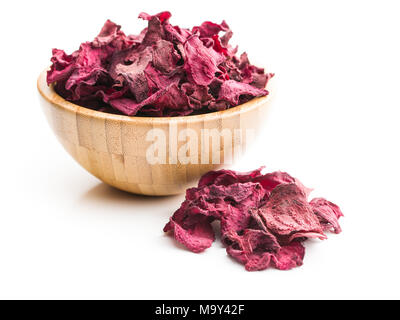 Dried beetroot chips in bowl isolated on white background. Stock Photo