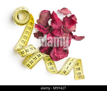 Dried beetroot chips and measuring tape isolated on white background. Stock Photo