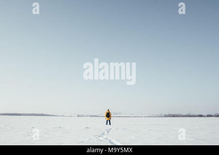 Alone traveler in yellow jacket Stock Photo