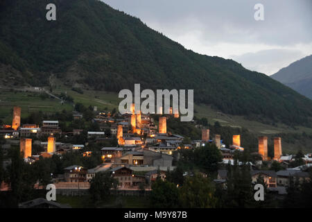 Historic tower houses stand amid more modern homes in Mestia, Svaneti region of the Caucasus Mountains, Georgia Stock Photo