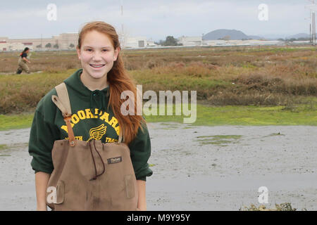 Excited for a day in the field. Girl Scout troop member, happy with her contributions to supporting endangered light-footed clapper rail recovery. Stock Photo