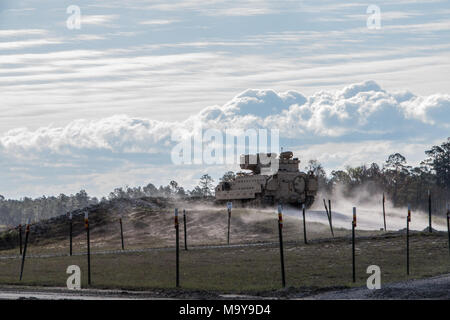 Troopers of 6th Squadron, 8th Cavalry Regiment, 2nd Armored Brigade Combat Team, 3rd Infantry Division, ground-guide their newly received M2 Bradley Fighting Vehicles to the range March 21, at Fort Stewart, Ga. This is the first time live rounds have been fired since the U.S. Army  announced that 3rd ID’s Spartan Brigade would convert from an infantry to an armored brigade combat team. (U.S. Army photo taken by Spc. Calab Franklin/Released)