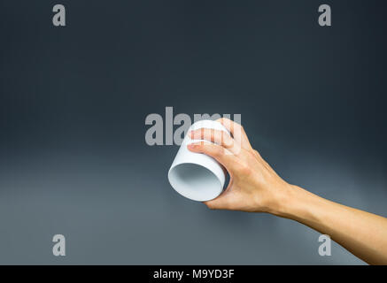 Empty coffee cup, hand holding upside down Stock Photo