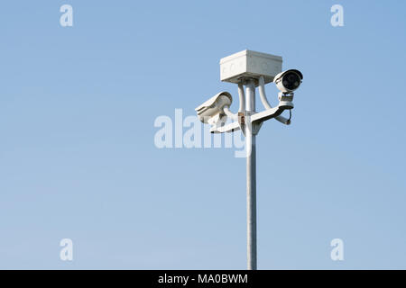 Outdoor CCTV camera security system, on blue background Stock Photo