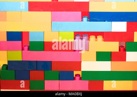 Colorful stacked toy plastic building blocks Stock Photo