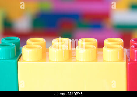 Colorful stacked toy plastic building blocks Stock Photo