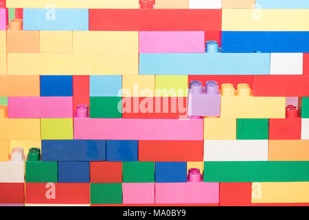 Colorful stacked toy plastic building blocks Stock Photo