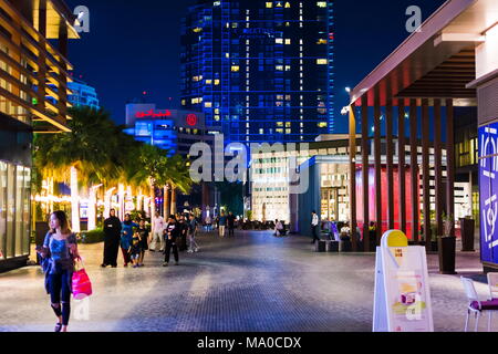 Dubai, United Arab Emirates - March 8, 2018: JBR, Jumeirah Beach Resort promenade at night with people walking, a new tourist attraction and residenti Stock Photo