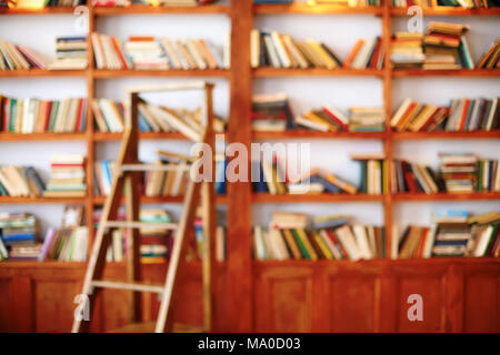 Books on bookshelf. Library room, abstract defocused blurred background Stock Photo