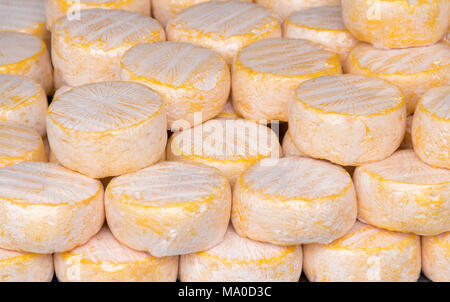 full frame shots showing lots of yellow cheese wheels Stock Photo