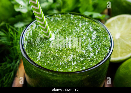 Green smoothie with vegetables, fruits and herbs. Healthy smoothie cocktail. Healthy drink and diet concept. Closeup Stock Photo