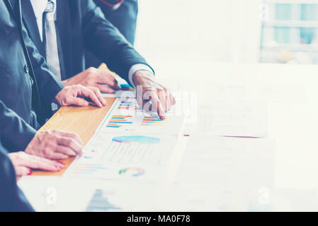 Business adviser analyzing financial figures denoting the progress in the work of the company Stock Photo