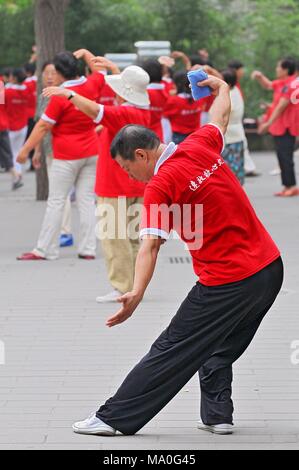 People practices traditional gymnastics in Jingshan Park in Beijing, China. Stock Photo