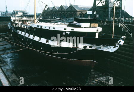 AJAXNETPHOTO. - 16TH FEBRUARY, 1972. SOUTHAMPTON, ENGLAND. - WOODEN WALL REFIT -  T.S. FOUDROYANT (EX TRINCOMALEE) UNDERGOING REPAIRS IN NR. 5 DRY DOCK.  PHOTO:JONATHAN EASTLAND/AJAX REF:357205 3 Stock Photo