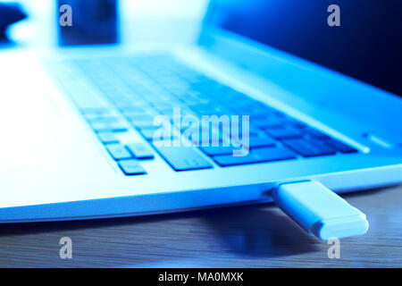 Close Up Of Computer Data Being Transfered From Laptop To Portable Drive Stock Photo