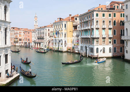 Gondoliers rowing gondolas with tourists on the Grand Canal, Cannaregio Venice, Veneto, Italy passing historical palazzos  in an elevated view Stock Photo