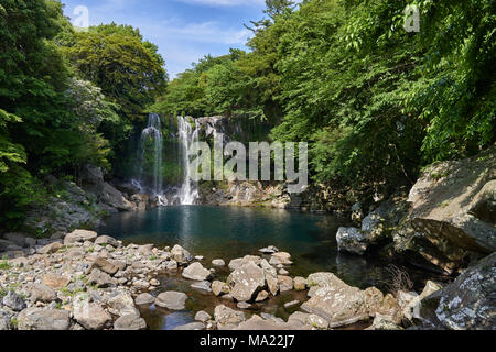 Cheonjeyeon 2nd waterfall. Cheonjeyeon is a three-tier waterfall, which is one of the most famous falls in Jeju island, Korea. Stock Photo