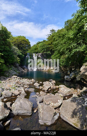 Cheonjeyeon 2nd waterfall. Cheonjeyeon is a three-tier waterfall, which is one of the most famous falls in Jeju island, Korea. Stock Photo