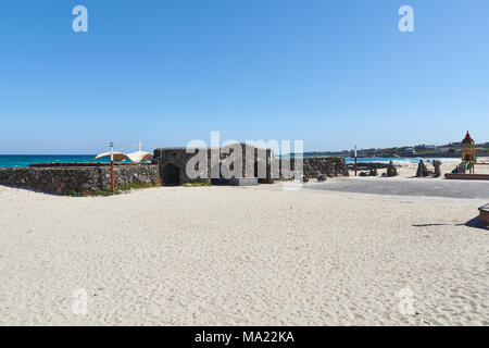 Gwakji  beach and Gwamul open-air public bath in Aewol. The beach is famous for its depth and breadth, fine sand. The bath on one side of the beach. Stock Photo