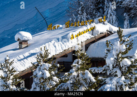 Snow covered restaurant in Pila ski resort, Aosta Valley, Italy Stock Photo