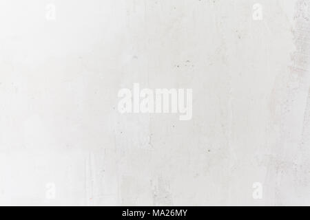 White concrete wall. Small cracks on the surface Stock Photo