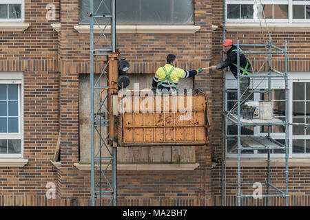Two men during construction works in a house in Cantabria, España Stock Photo